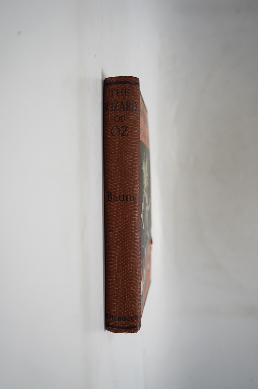 Baum, Frank - The Wizard of Oz, illustrated by W.W. Denslow, 12mo, pictorial front board over red cloth, Hutchinson & Co, London, [1926].